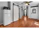 Open-concept living area with hardwood floors, barn door, and modern amenities at 5631 Shelby St, Indianapolis, IN 46227