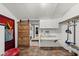 Functional mudroom features a sliding barn door, laundry appliances, and counter space at 5631 Shelby St, Indianapolis, IN 46227
