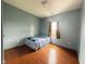 Bedroom featuring wood floors and lots of natural light from a window at 621 Appleseed Way, Indianapolis, IN 46217
