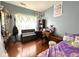 Bedroom featuring wood floors, bench seating and desk at 621 Appleseed Way, Indianapolis, IN 46217
