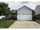 Charming single Gathering home with a large front yard, brick details, and attached two car garage at 621 Appleseed Way, Indianapolis, IN 46217