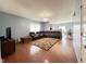 Open concept living room with hardwood floors, comfortable seating and chandelier at 621 Appleseed Way, Indianapolis, IN 46217