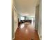 Spacious living area showcases wood floors and an inviting open layout to the dining area at 621 Appleseed Way, Indianapolis, IN 46217