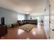 Bright living area with hardwood floors, a comfortable sectional, and an open layout to dining at 621 Appleseed Way, Indianapolis, IN 46217