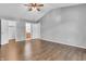 Large primary bedroom with hardwood floors and ensuite bathroom, with closet access at 6329 Whitaker Farms Dr, Indianapolis, IN 46237