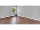 Bedroom featuring a hardwood floor and window in the room at 6329 Whitaker Farms Dr, Indianapolis, IN 46237