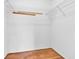 Walk-in closet provides ample storage with wire shelving and hardwood flooring at 6329 Whitaker Farms Dr, Indianapolis, IN 46237