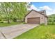 Charming home with a brick facade, two-car garage, and long concrete driveway at 6329 Whitaker Farms Dr, Indianapolis, IN 46237