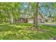 Spacious two-story home with a large front yard and mature trees at 6329 Whitaker Farms Dr, Indianapolis, IN 46237