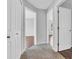Hallway view with carpet, doors and hardwood flooring in other rooms in this home for sale at 6329 Whitaker Farms Dr, Indianapolis, IN 46237