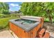 Relax in your private hot tub, perfect for unwinding, and set in a serene backyard setting at 6329 Whitaker Farms Dr, Indianapolis, IN 46237