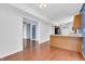 Open-concept living space with hardwood floors, providing seamless transitions to the kitchen and other areas at 6329 Whitaker Farms Dr, Indianapolis, IN 46237