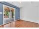 An inviting room with sliding door access to the deck, hardwood floors, and bright interior paint at 6329 Whitaker Farms Dr, Indianapolis, IN 46237