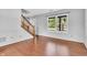 Cozy living room with wood floors and large windows, perfect for natural light at 6329 Whitaker Farms Dr, Indianapolis, IN 46237