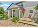 An inviting sunroom adds warmth and brightness to this house, with easy access to the outdoor patio at 6329 Whitaker Farms Dr, Indianapolis, IN 46237
