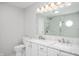 Bright bathroom boasts double sinks, white marble countertops, and modern finishes at 6562 Quail Run, Fishers, IN 46038