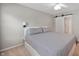 Neutral bedroom features new windows, a ceiling fan, and an ensuite bathroom at 6562 Quail Run, Fishers, IN 46038