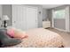 Cozy bedroom with a floral bedspread, large closet, and neutral paint at 6562 Quail Run, Fishers, IN 46038