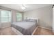 Neutral bedroom features new windows, a ceiling fan, and a comfortable bed at 6562 Quail Run, Fishers, IN 46038
