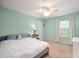 Bedroom with natural light, a ceiling fan, and neutral carpet at 6562 Quail Run, Fishers, IN 46038