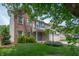 Beautiful two-story home with a mix of brick and vinyl siding, blue shutters and a lovely lawn at 6562 Quail Run, Fishers, IN 46038