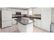 Bright kitchen features an island, stainless steel appliances, and ample cabinet space at 6562 Quail Run, Fishers, IN 46038