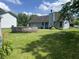 Private backyard with an above-ground pool, lawn, and mature plantings, ideal for relaxation and entertainment at 6932 Deerbrook Ct, Indianapolis, IN 46214