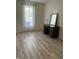 A bedroom featuring light, airy decor, a spacious desk, and plenty of natural light from a large window at 6932 Deerbrook Ct, Indianapolis, IN 46214