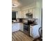Well-appointed kitchen with white cabinets, updated stainless steel appliances, and hardwood countertops at 6932 Deerbrook Ct, Indianapolis, IN 46214