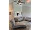 Bright living room showcasing plush sofas and an open view to the kitchen at 6932 Deerbrook Ct, Indianapolis, IN 46214
