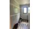 Unfinished room ready for customization, featuring a window for natural light and new floors at 6932 Deerbrook Ct, Indianapolis, IN 46214