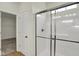 Bathroom featuring a shower with sliding glass doors and easy access to the walk-in closet at 7205 Rose Hill Ave, Brownsburg, IN 46112