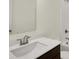 Bathroom vanity with white countertop, dark wood cabinets, chrome faucet and sink at 7205 Rose Hill Ave, Brownsburg, IN 46112