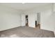 This carpeted bedroom offers easy access to the kitchen and bathroom and lots of natural light at 7205 Rose Hill Ave, Brownsburg, IN 46112