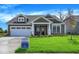 Charming home with a two-car garage, manicured lawn, and a welcoming front porch at 7205 Rose Hill Ave, Brownsburg, IN 46112