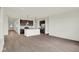Spacious living room with hardwood floors, connected to an open-concept kitchen at 7205 Rose Hill Ave, Brownsburg, IN 46112