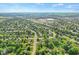 This aerial view captures the property's location in a peaceful suburban neighborhood near a highway and shopping at 7239 N Orchard Dr, Indianapolis, IN 46236