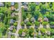An aerial view shows the property nestled in a mature neighborhood with tree-lined streets and green spaces at 7239 N Orchard Dr, Indianapolis, IN 46236