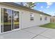 The home's backyard shows a concrete patio along the side of the home at 7239 N Orchard Dr, Indianapolis, IN 46236