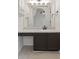 Bathroom featuring a vanity with dark cabinets and a large mirror, and tiled floors at 7239 N Orchard Dr, Indianapolis, IN 46236
