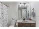 Bathroom with a patterned shower curtain and a modern vanity at 7239 N Orchard Dr, Indianapolis, IN 46236