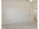 Bright bedroom with neutral carpet, ceiling fan, and doorway leading to hallway at 7239 N Orchard Dr, Indianapolis, IN 46236