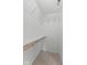 Bright walk-in closet features wire shelving and a clothing rod for ample storage space at 7239 N Orchard Dr, Indianapolis, IN 46236