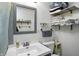Bathroom featuring a well-lit vanity, a practical toilet, and shelving for ample storage at 7307 Twin Beech Dr, Indianapolis, IN 46226