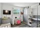 Well-lit bedroom featuring a crib, a daybed, and a mirrored wardrobe, offering both style and functionality at 7307 Twin Beech Dr, Indianapolis, IN 46226