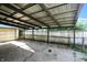 Large, covered carport perfect for vehicle storage or an outdoor workspace, featuring metal supports at 7307 Twin Beech Dr, Indianapolis, IN 46226
