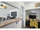 Open-concept view from bar counter through to comfortable living room with a work area at 7307 Twin Beech Dr, Indianapolis, IN 46226