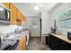 Functional kitchen featuring modern appliances, wooden cabinets, and direct access to exterior at 7307 Twin Beech Dr, Indianapolis, IN 46226