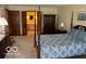 Bedroom with view to ensuite bathroom, with traditional style decor and carpet at 7334 Fairwood Cir, Indianapolis, IN 46256