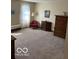 Bedroom featuring vintage decor and carpet with neutral walls and light at 7334 Fairwood Cir, Indianapolis, IN 46256